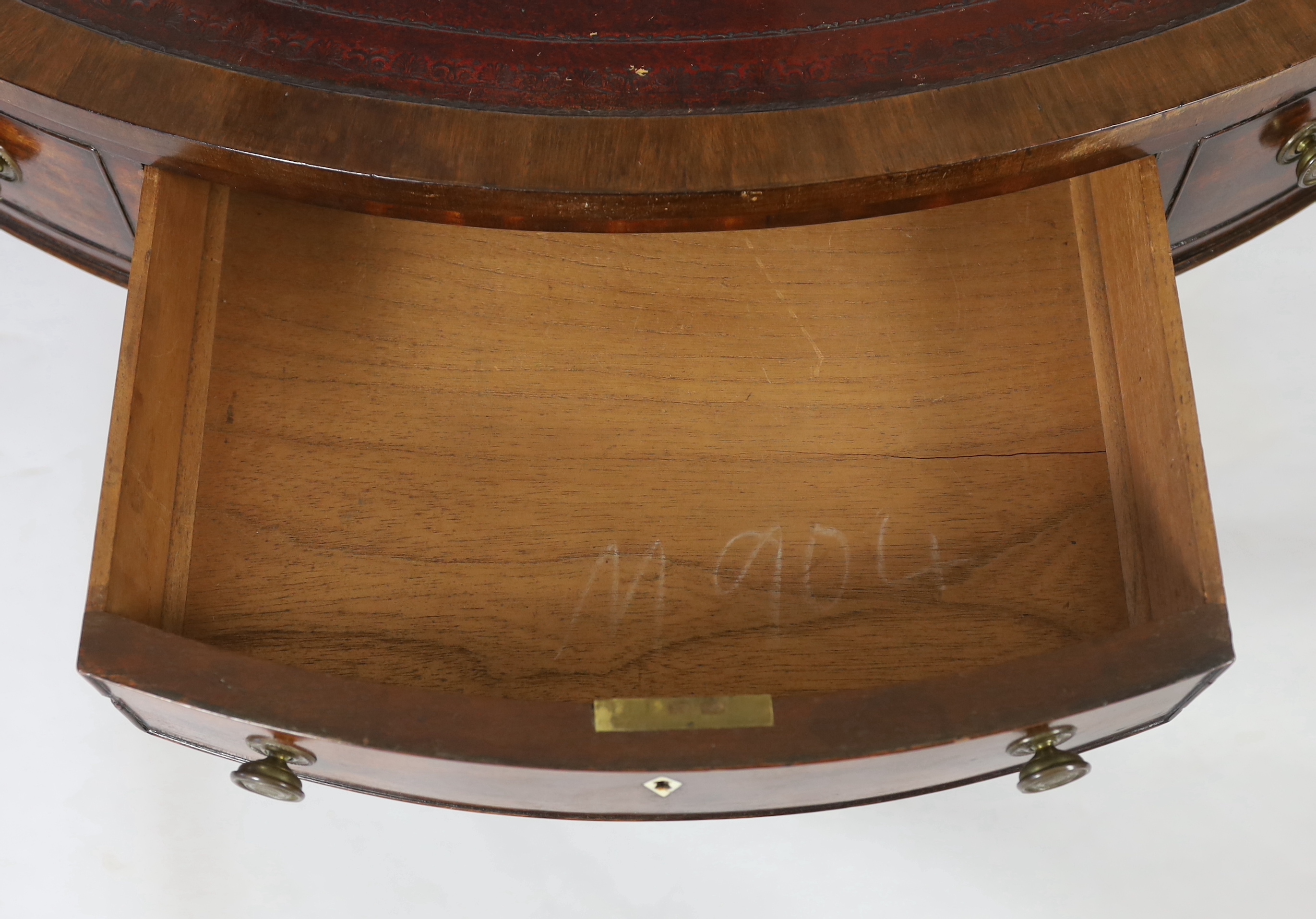 A Regency mahogany drum top library table